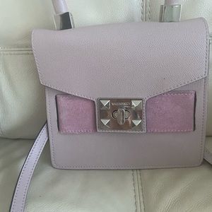 Elegant and classy handbag. Can be worn as a crossbody.